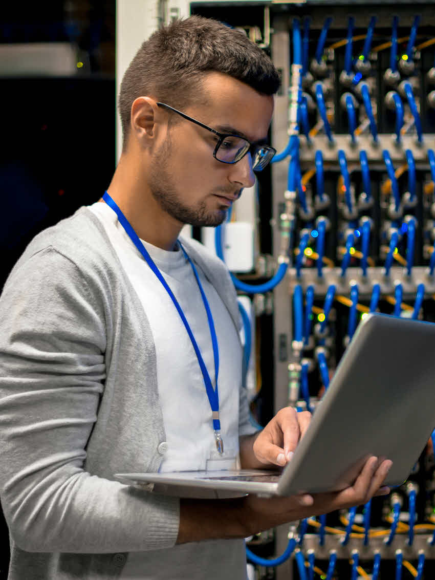 Male technical assistant working in the server room